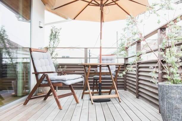 Outdoor Chair and Umbrella on Deck | Composite Decking Ideas for Small Gardens